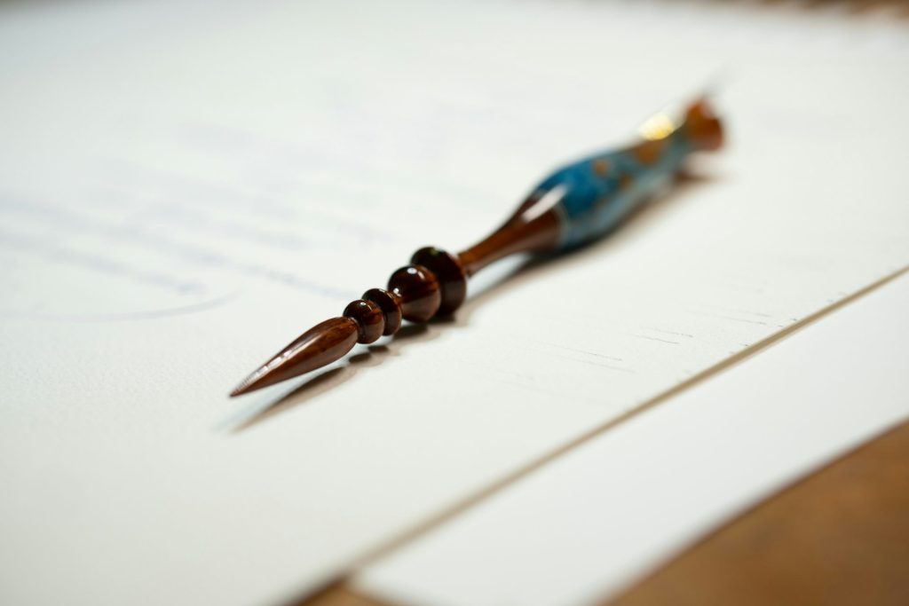 a close up of a pen on a piece of paper